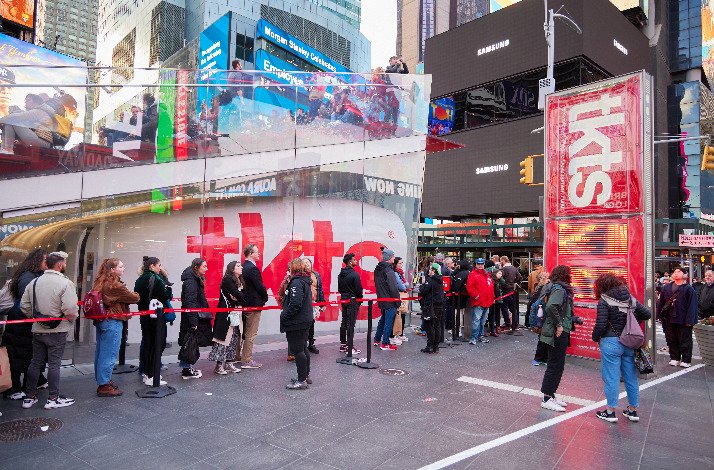 A crowd of people queue at TKTS Times Square.