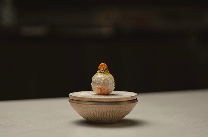 Unusual presentation of dessert Tea Smoked Sakuramasu.