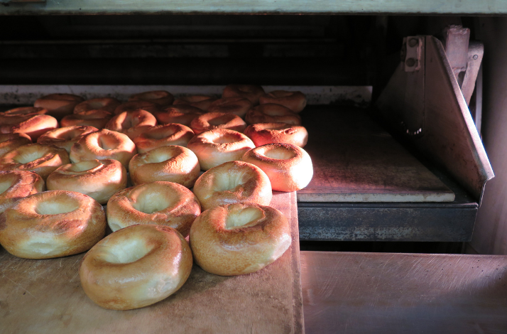 Baked bagels coming out of the oven at Russ & Daughters. 