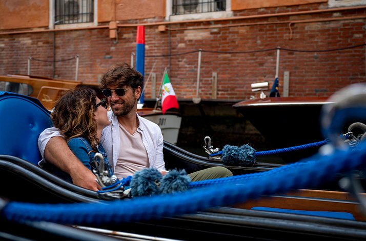 A couple enjoying ride on gondola.