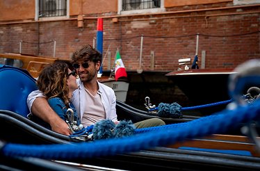 A couple enjoying ride on gondola.