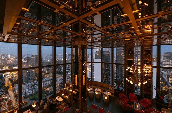The cozy interior of Park Hyatt Bangkok's plush Penthouse Bar + Grill.