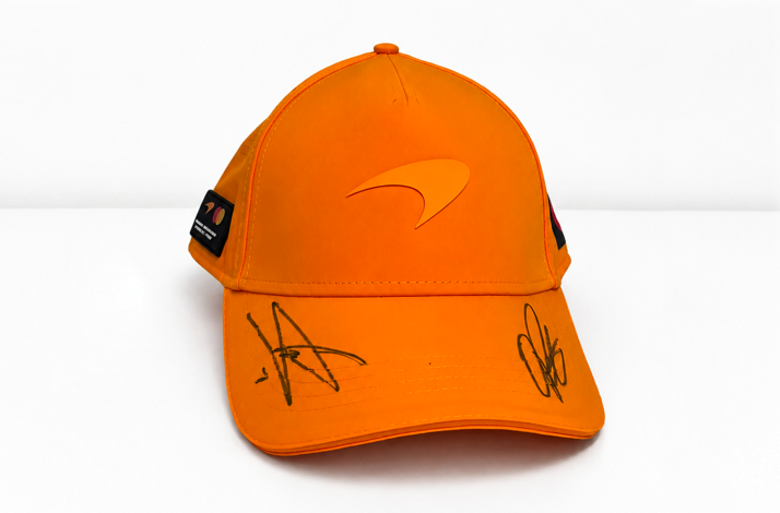 McLaren Premium Partner cap signed by Lando Norris and Oscar Piastri.