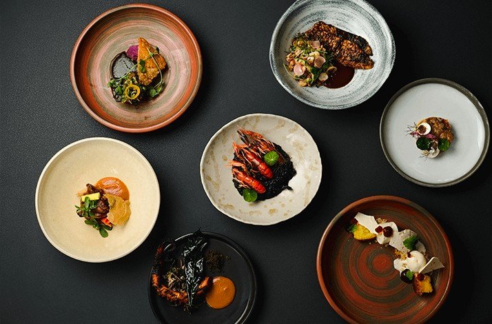 Lots of plates with different delicious Merah Putih dishes.