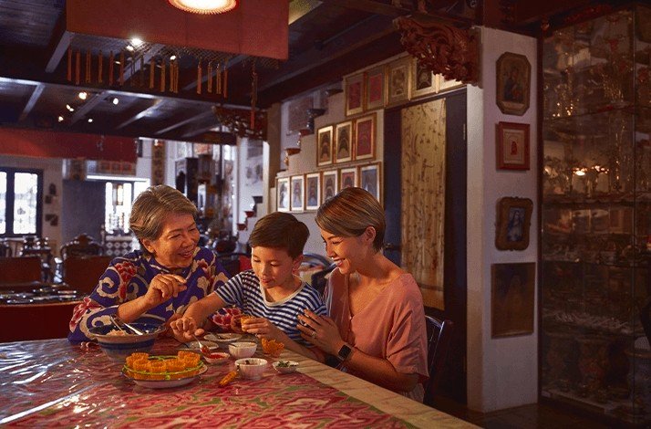 People enjoying their food inside Alvin's home.