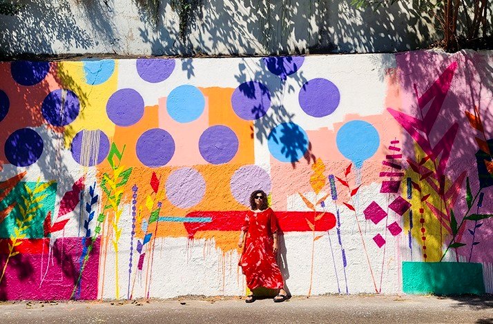 Vibrant street art with bold patterns, colorful plants, and abstract shapes