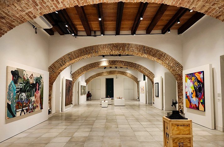 Elegant art gallery with brick arches and captivating contemporary pieces