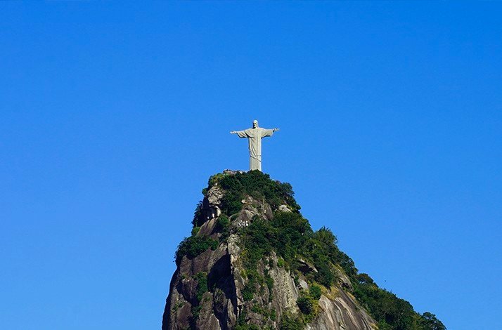 Iconic Christ the Redeemer statue atop Corcovado Mountain under clear blue skies