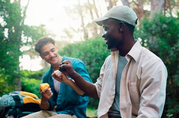 Travelers enjoying a break in a green forest setting of Parque Nacional da Tijuca.