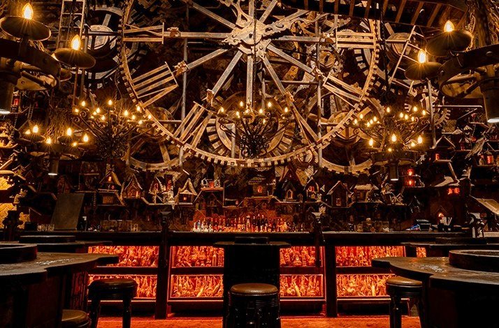 Various steampunk decorations inside The Iron Fairies, a giant Iron clock is in the middle of the photo.