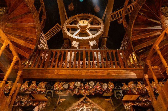 Various steampunk decorations inside The Iron Fairies, a giant Iron clock is in the middle of the photo.