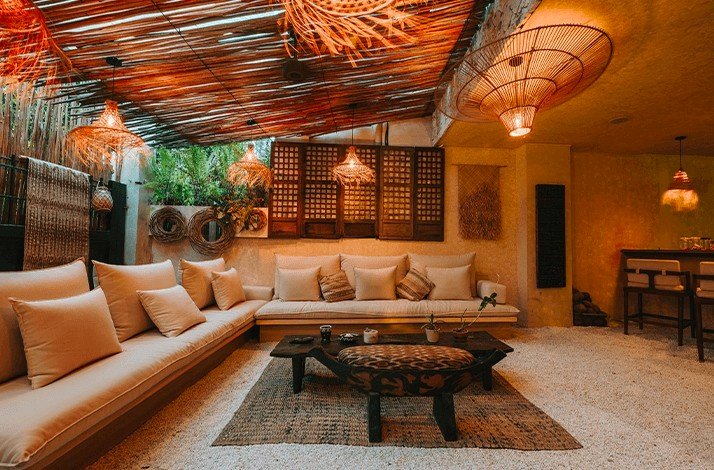 Cozy lounge with earthy tones, natural decor, and warm lighting