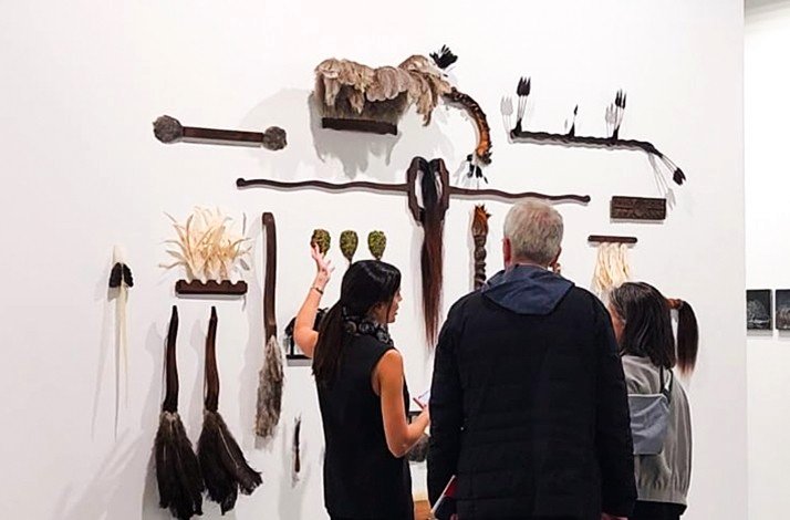 Guests enjoying a private art collection at Culto Gallery, Bogotá, Colombia.