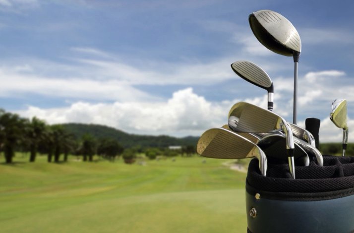A carry bag with golf clubs.