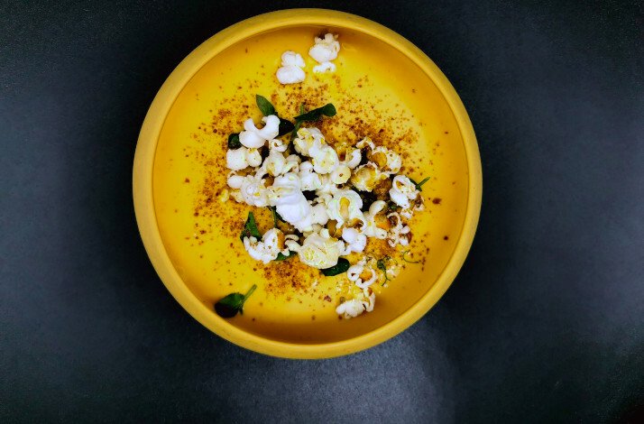 A wonderful dish by chefs Benjamin and Aurélien Michel at Popâ on a yellow plate.