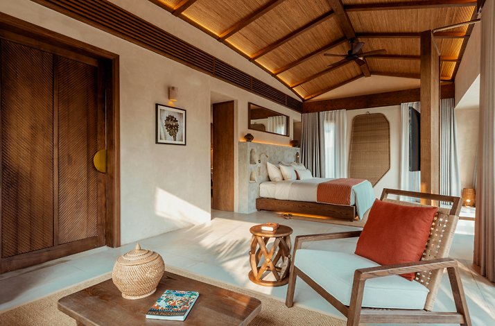 Cozy bedroom with rustic furnishings, wood accents, and warm lighting