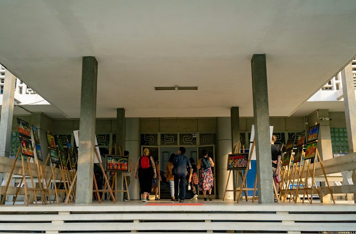 People entering a building in Ho Chi Minh City's vibrant District 1.