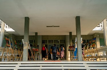 People entering a building in Ho Chi Minh City's vibrant District 1.