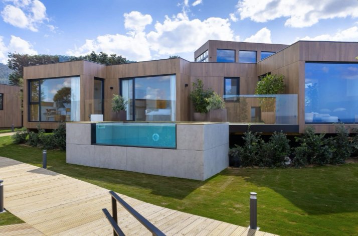 Modern sustainable shelter with sleek architecture and a glass pool