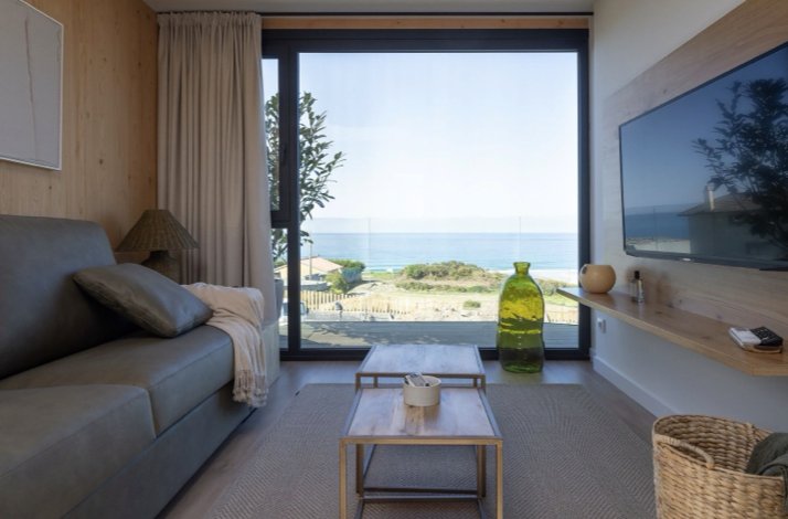 Living space with ocean views, elegant decor, and natural light