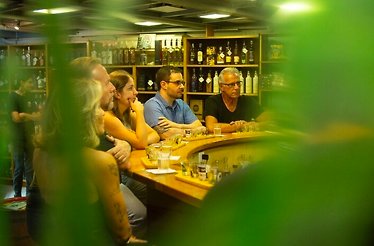 People listen attentively to achaça expert about country's iconic cocktail - caipirinha.