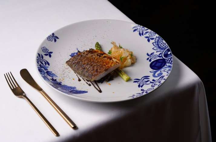 One of the dishes from LUMA's tasting menu displayed on the table.