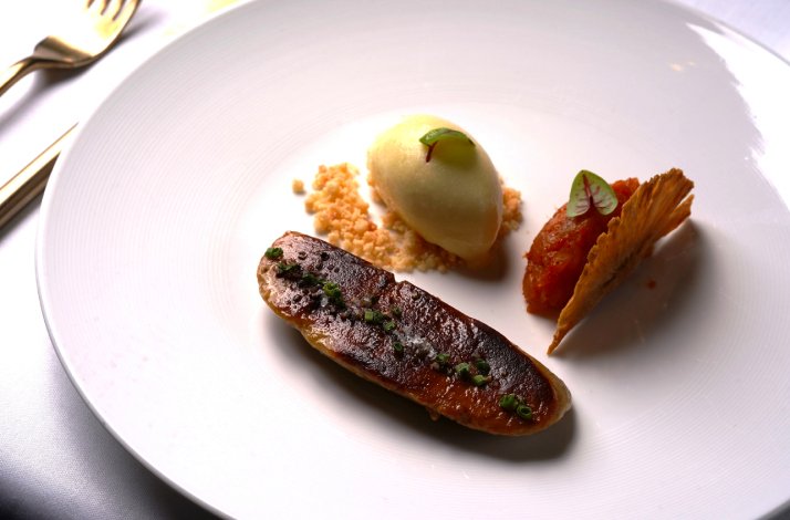 One of the dishes from LUMA's tasting menu displayed on the table.