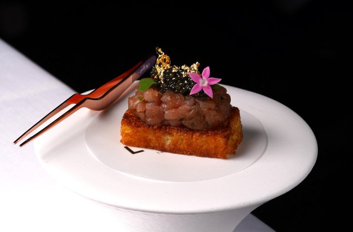 One of the dishes from LUMA's tasting menu displayed on the table.