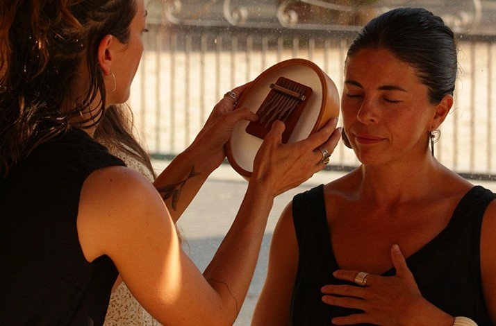 A participant of artist Fabiana Burr's class engaging in soundscapes.