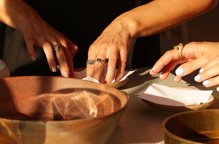 Participants making artwork on artisanal paper on a class guided by artist Fabiana Burr.