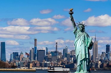 Aereal view of the Statue of Liberty and building at the backgroud