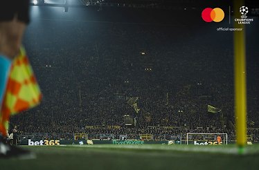 Packed stadium during a UEFA Champions League match.