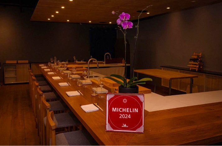 A spacious table set for multiple guests at the Michelin-starred Shota Omakase.