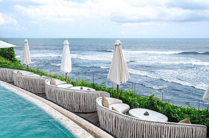 View at the ocean from daybeds at the coast in Bali.