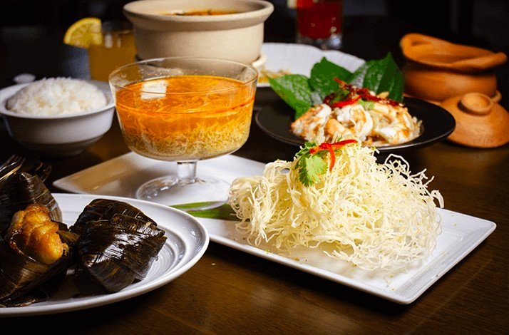 Traditional Thai food served in a clay pot at Nai Lert Park Heritage Home.