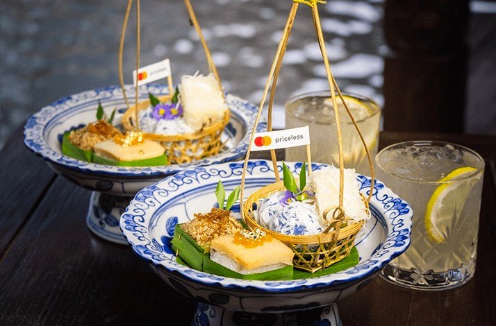 Traditional Thai desserts served in ornate dishes at Nai Lert Park Heritage Home.