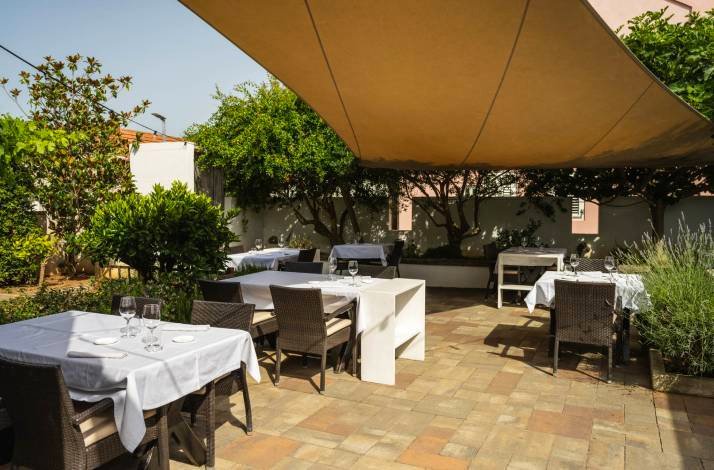 Outdoor eatery setting at Konoba Boba restaurant.