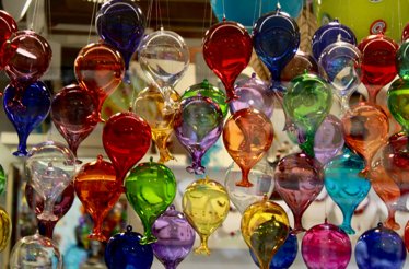 The display of colorful handblown glass balloons in Hong Kong's leading glassware studio