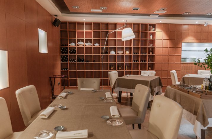 Elegant dining area with neatly set tables and a warm, inviting ambiance