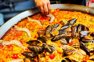 Close shot of a large pan of paella