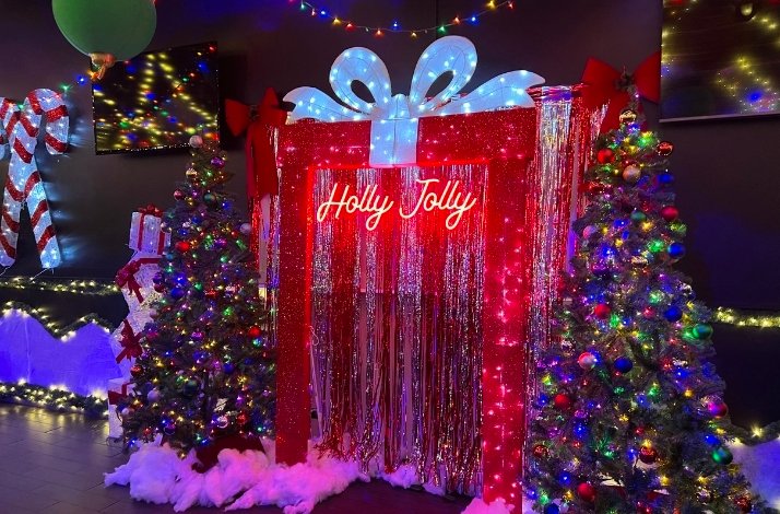 Toast to the start of the holiday season at Holly Jolly Bar: In New York, New York Christmas decorations in the shape of a gift box at Holly Jolly Bar