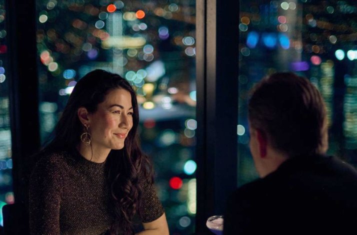A couple sharing a dinner inside of Eureka Tower at Eureka 89 restaurant