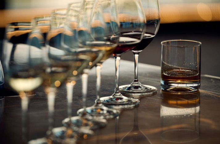 A lot of glasses with different type of wines in row