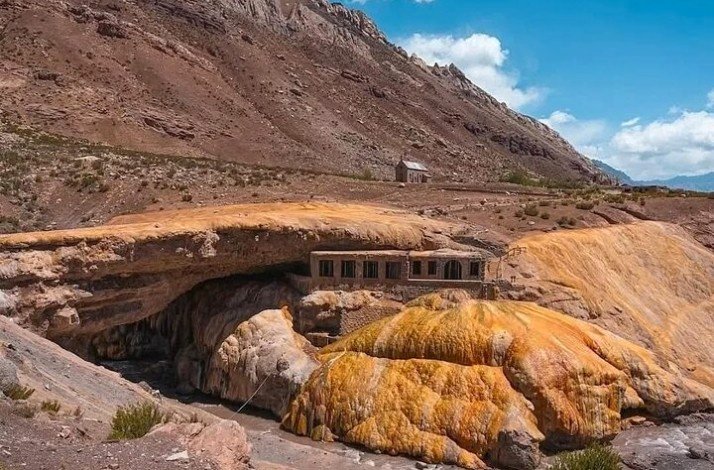 Puente del Inca is a natural arch that forms a bridge over the Las Cuevas River, a tributary of the Mendoza River.