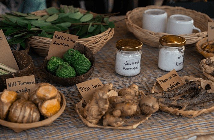 A table full of traditional Thai herbal medicine ingredients at Wonderfruit 2025.