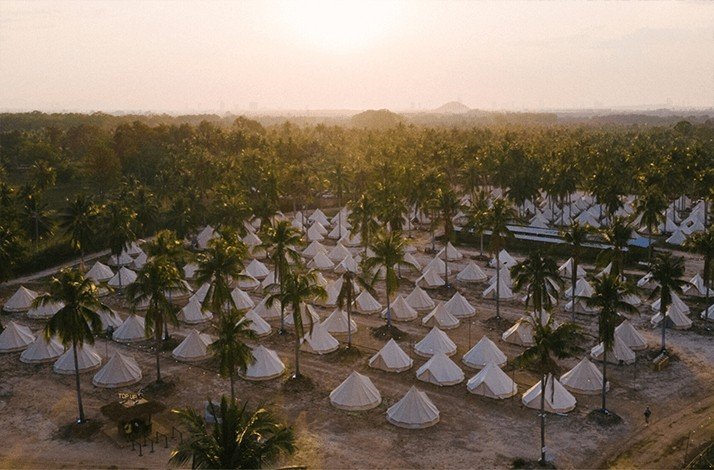 Aerial view of the Wonderfruit's boutique camping tents in a special pavilion.   