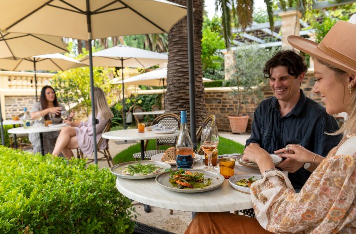 A pair of persons enjoying  a lunch at Seppeltsfield Wines