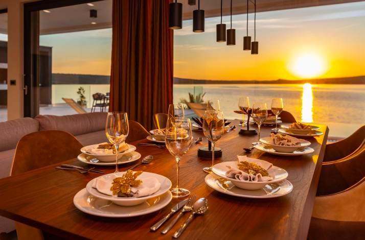 A table served in the restaurant near the seashore on the sunset