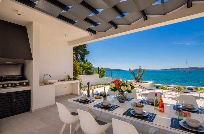 A table served on the shady terrace near the sea in Croatia