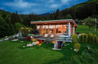 View of a minimalistic wooden cabin built from Scandinavian timber in a fairytale-like landscape at Eden Hill Retreat & Spa.